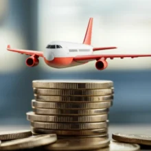 Cute-3D-airplane-flying-over-a-stack-of-Korean-Won-coins