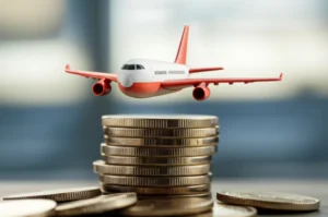 Cute-3D-airplane-flying-over-a-stack-of-Korean-Won-coins