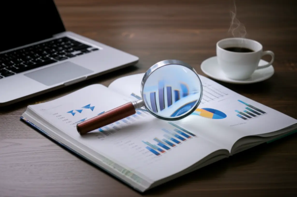A-cute-3D-rendering-of-a-magnifying-glass-over-an-admission-guide,-with-charts-and-a-desk-setup,-symbolizing-analytical-study.