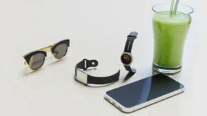 Cute-3D-image-showing-modern-lifestyle-items-like-a-smartphone,-fitness-tracker,-healthy-drink,-and-fashion-accessory.