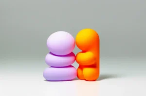 Two-abstract-3D-figures,-one-soft-and-pastel-(Egen),-one-sharp-and-vibrant-(Teto),-subtly-interacting-to-represent-different-personality-traits.