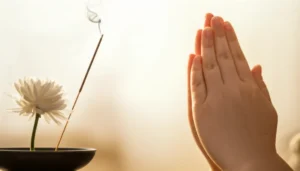 A-gentle-image-symbolizing-funeral-etiquette-with-a-chrysanthemum,-incense,-and-clasped-hands-for-condolences.